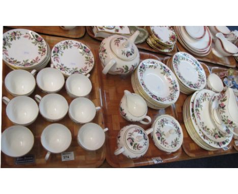 Three trays of Wedgewood bone china 'Hathaway Rose' R4317 tea and dinnerware items comprising teacups and saucers, sucrier, m