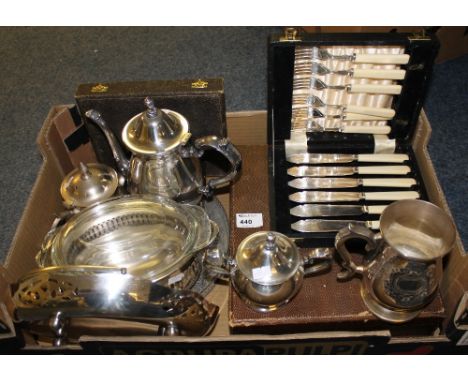 Tray of assorted metalware to include cased cutlery, pierced cake basket, plated tea service and tray, tankard etc. 