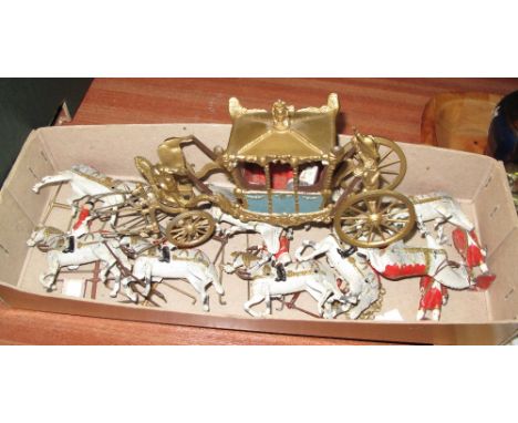 Vintage diecast Britains Coronation Coach with figures on horseback.