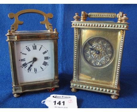 French brass carriage clock with geometrically decorated case and another similar smaller.  (2)