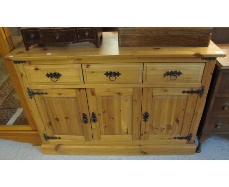 Modern pine sideboard with metal handles and bracket on a platform base.