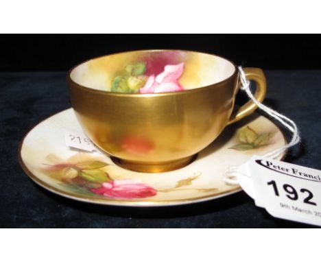 Royal Worcester porcelain cabinet cup and saucer decorated with roses to the interior and gilded externally. Printed marks. 