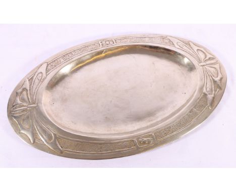 Art and crafts white metal tray of oval form decorated with butterflies in the Glasgow school style, 53cm wide.