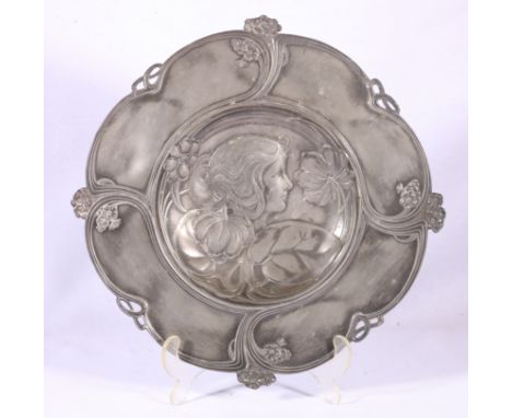 WMF pewter dish decorated in the Art Nouveau taste with maiden and floral motifs. 32cm CONDITION REPORT: Dents in places, doe