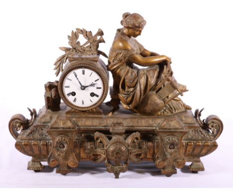 French gilded metal drum head mantle clock with figure surmount, the works back plate stamped Marti.
