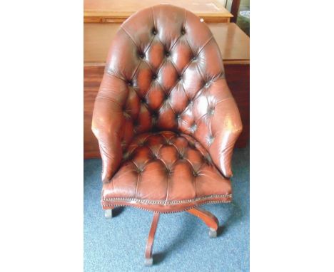 Reproduction button backed swivel desk chair upholstered in ox blood red