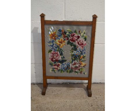 An oak framed fire screen