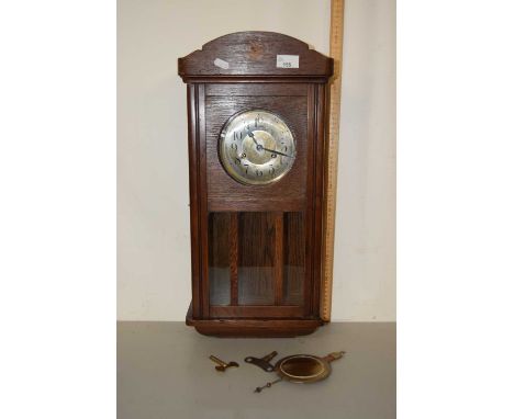 An early 20th Century oak cased mantel clock