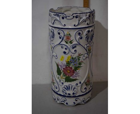 A floral decorated porcelain stick stand