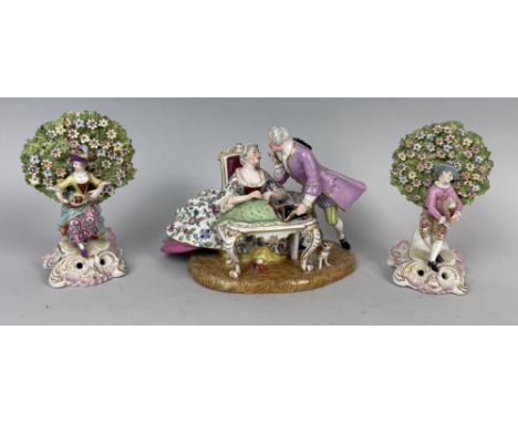 TWO CHELSEA STYLE PORCELAIN FIGURES PLAYING MUSICAL INSTRUMENTS, ALONG WITH A LARGER PORCELAIN GROUPLargest 23cm L