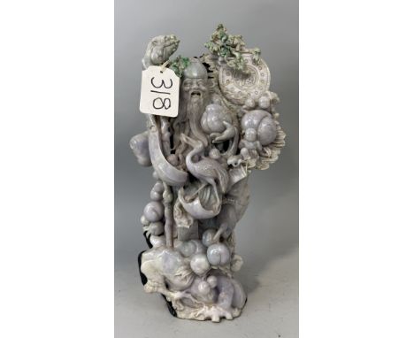 A CHINESE JADE OR JADEITE SCULPTURE DEPICTING A FIGURE WITH BIRD AND FRUIT52cm x 30cm