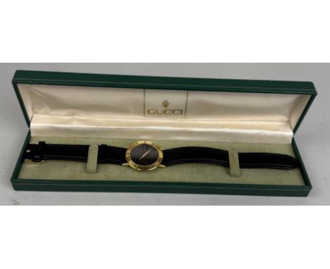 A CASED GUCCI WRISTWATCHIn Gucci box