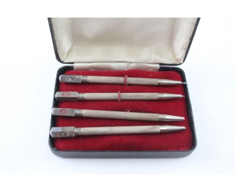 A SET OF FOUR .925 STERLING SILVER CRIBBAGE PENCILS WITH ENAMEL DETAIL