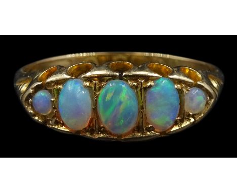 Early 20th century 18ct gold graduating opal ring, hallmarkedCondition Report:Approx 2.55gm, size P, max depth = 6.5mmsome ru