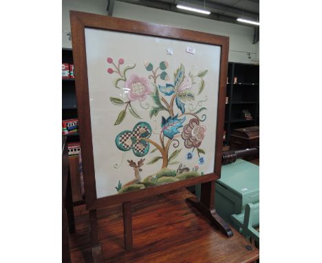 An embroidered fire screen/table