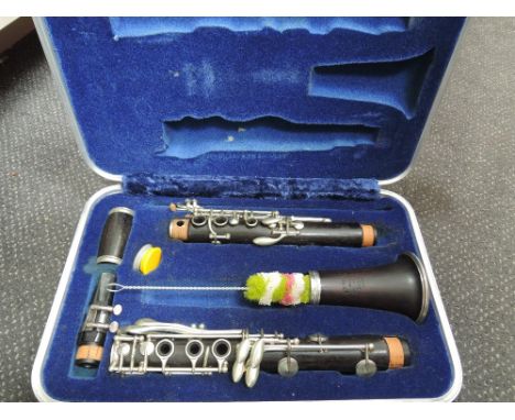 A clarinet, impressed mark 'buisson sole distributors Dallas/London) , in fitted case