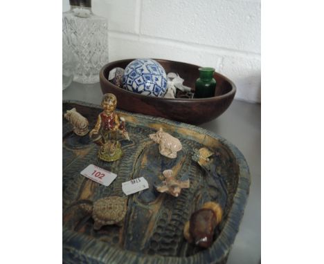 A studio pottery tray with a selection of Wade Whimsies and decorative carpet bowl, treen bowl, marble egg etc