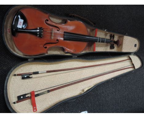 A traditional violin having two piece back, case and bow