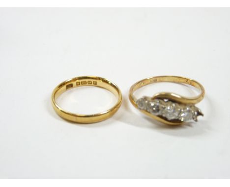 18CT &amp; 22CT GOLD RINGS (2) to include an 18ct gold and platinum crossover example set with four diamonds plus one lacking