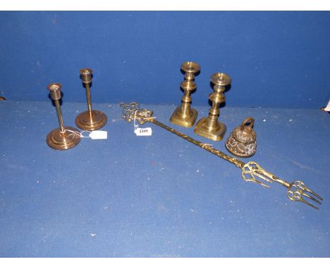 A small quantity of brass to include; a pair of 20th Century Art Deco candlesticks, a pair of ejector baluster candlesticks, 