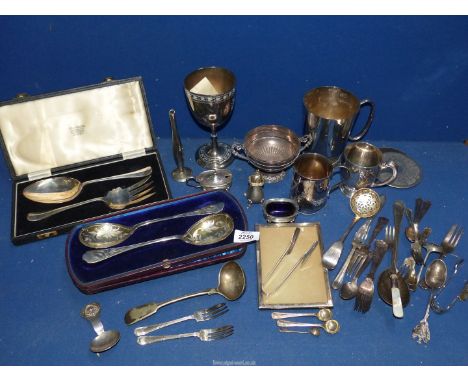 A quantity of plated items to include a pair of serving spoons, meat fork, casserole spoon, goblets, tankard, etc.