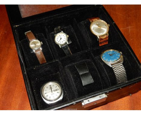 A watch dispaly case containing Five watches including an Avia 17 jewels incabloc gents watch with blue face, baton hour mark
