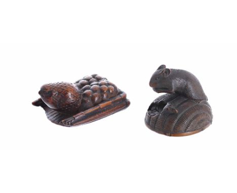Two Japanese wood netsuke, late 18th to mid 19th century, the first a quail resting, its head raised on a winnowing basket fi