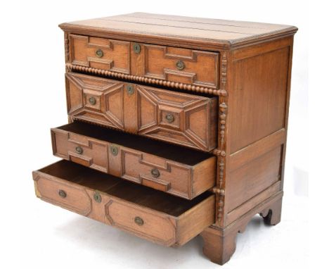 17th/18th century oak split moulded chest of drawers, with four panelled long drawers upon bracket feet, 39" wide, 23" deep, 