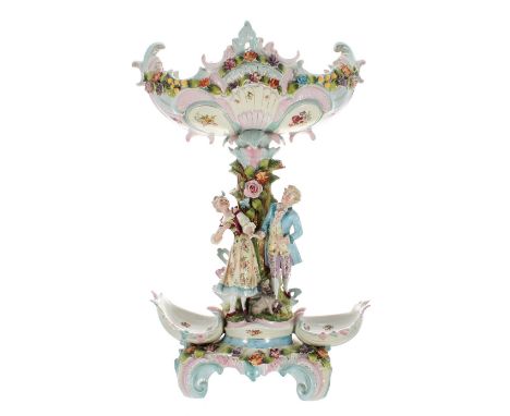 Large German porcelain figural encrusted centrepiece, the serpentine scrolled basket on a naturalistic tree trunk pedestal fl