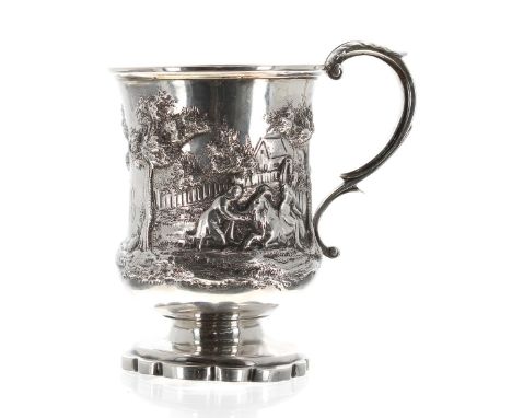 Victorian silver pedestal christening cup, with a leaf capped scrolling handle and embossed with a farm and pastoral scene, g