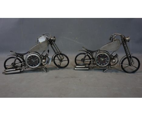 A pair of contemporary desk clocks in the form of vintage motorbikes, each having two dials with Arabic numerals, H.28 W.51cm