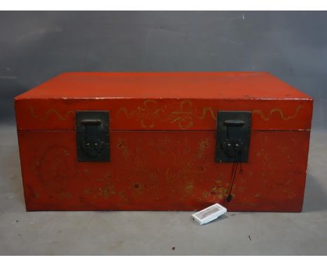 A late 19th/early 20th century Chinese red lacquered trunk, with character mark inside, H.33 W.79 D.52cm 