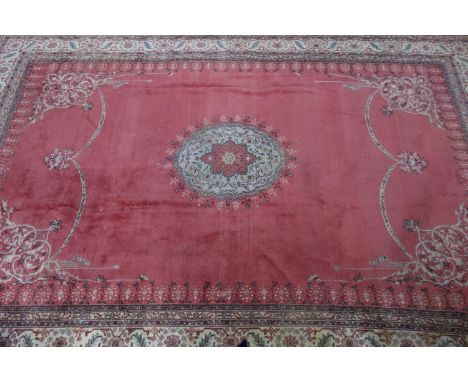 A large early 20th century Persian design carpet, with label for Maple &amp; Co. London, central floral medallion and floral 