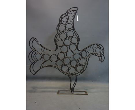 A vintage wrought iron wine rack in the form of a dove, H.110 W.96 D.15cm 