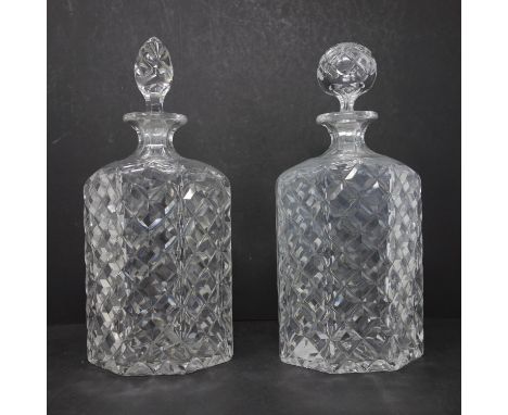 A pair of vintage crystal decanters, one with replaced stopper, H.26.5cm and H.27cm 