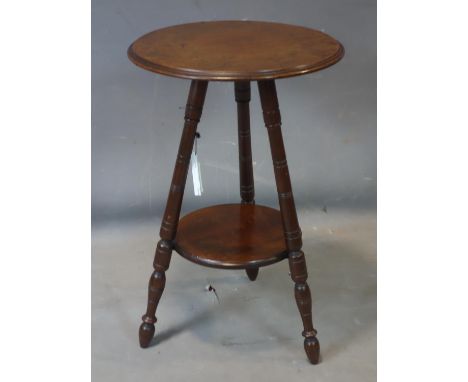 An Arts &amp; Crafts mahogany lamp table 