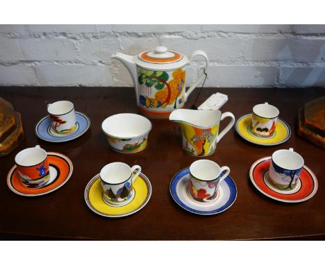 A Wedgwood Clarice Cliff Connoisseur Collection to include a 'Cornwall' tea pot, a 'Wind bells' jug and 'Secrets' sugar bowl 