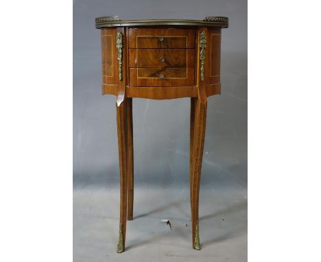 A 20th century French walnut oval lamp table, with 3 drawers and brass gallery top, H.71 W.41 D.32cm 
