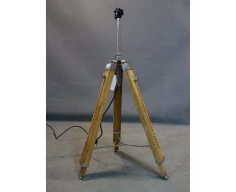 A contemporary teak and chrome adjustable tripod standard lamp, H.106cm fully extended 