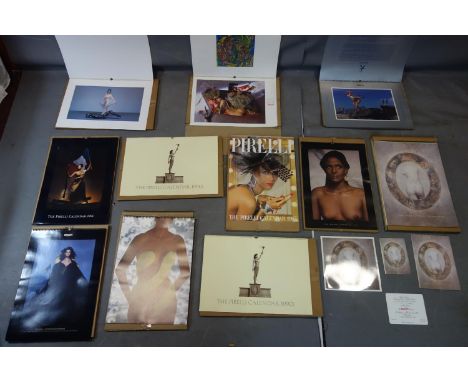 A collection of 11 vintage Pirelli calendars, comprising 1985-1993, with an embossed 1988 edition, a 1989 edition with vinyl 