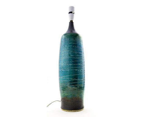 Andre Loret for Sidmouth, a studio pottery lamp base, cylindrical bottle form, incised with bands, glazed in blue and green, 
