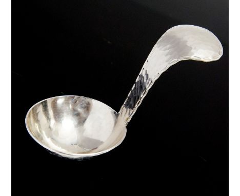 Keswick School of Industrial Arts, a Firth Staybrite caddy spoon, hand hammered with punched chain border 