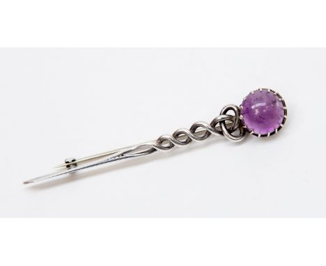 William Drummond, an Australian silver and amethyst brooch, Celtic style with twisted rope design terminating in a cabouchon 