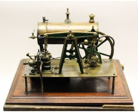 Steam Engine: A brass steam powered boiler on mahogany plinth, in box
