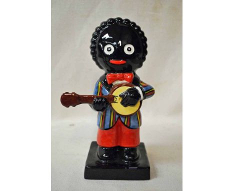 A Carlton Ware pottery model of a Golly playing a Banjo, left handed, colour trial piece, gold factory mark, inscribed Colour