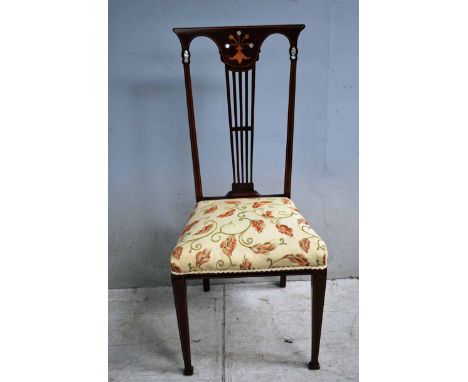 An Arts and Crafts Mahogany Bedroom Chair, inlaid back with openwork splat inlaid with mother of pearl, upholstered seat, squ