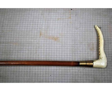 An Early 20th Cane Sword Stick, Antler Handle, 72cm blade in 89cm brass mounted cane scabbard 