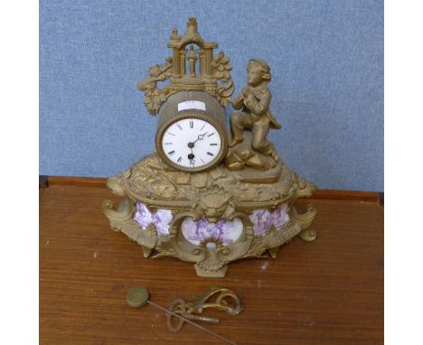 A 19th Century French gilt metal and porcelain mantel clock 