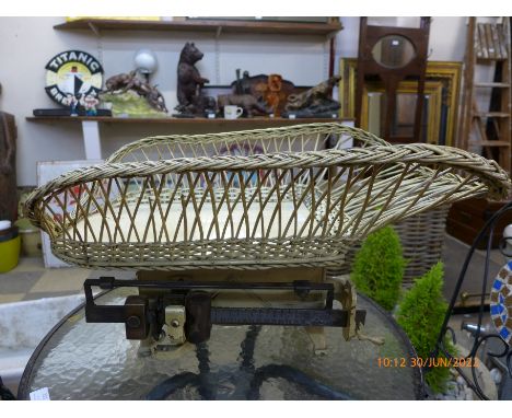 A set of vintage baby weighing scales 