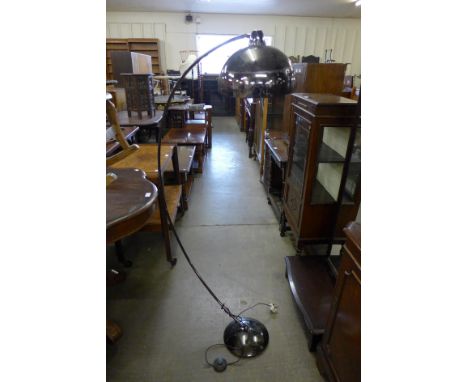 A metal floor standing arc lamp 